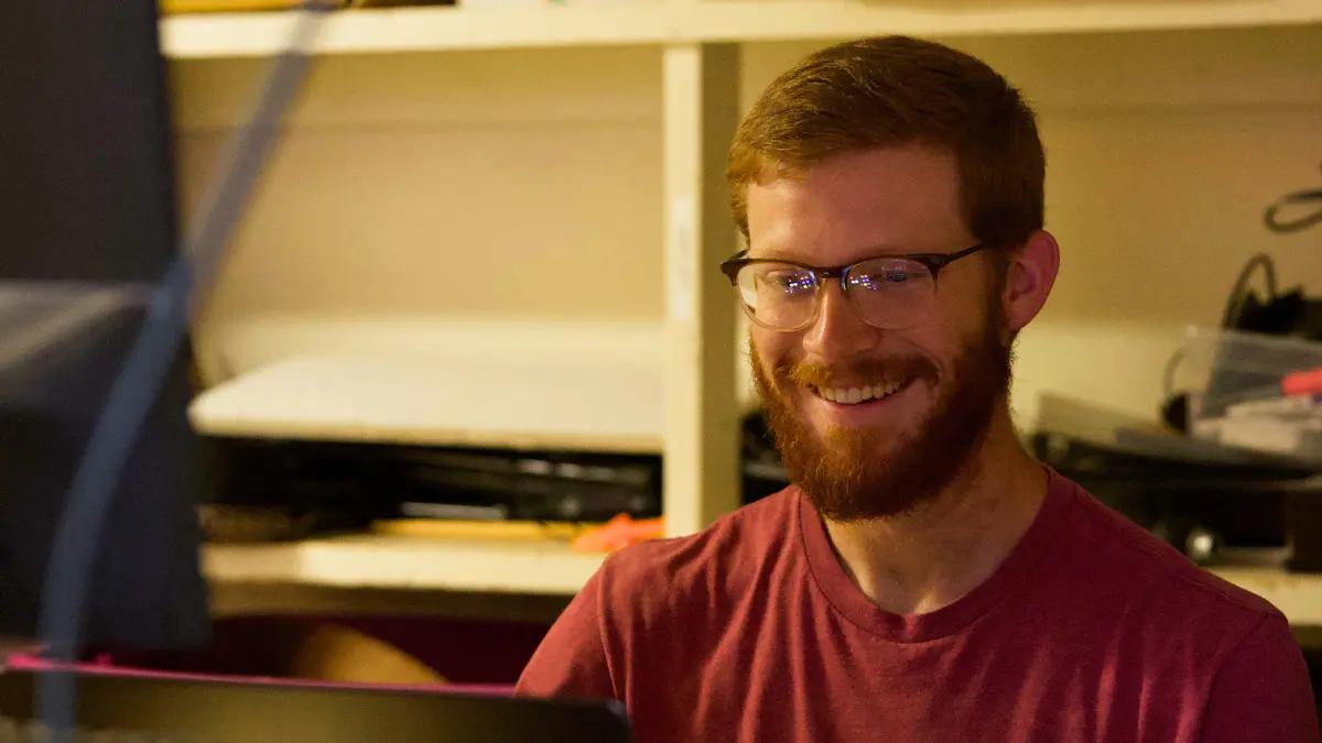 Josh smiling as he runs production at Immanuel in Richmond