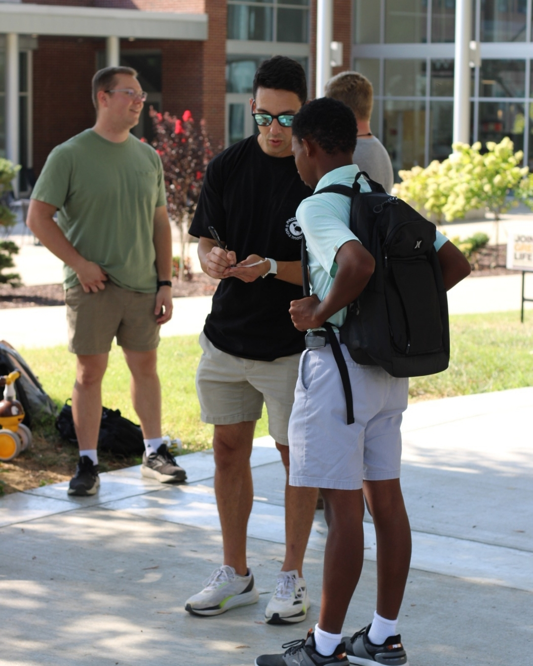 Immanuel Baptist Church staff sharing the Gospel Bridge Diagram with a college student at the Eastern Kentucky University
