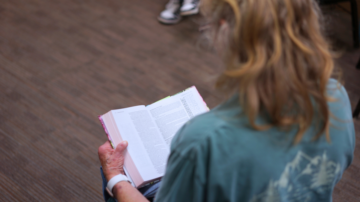 Brenda reading Bible in group