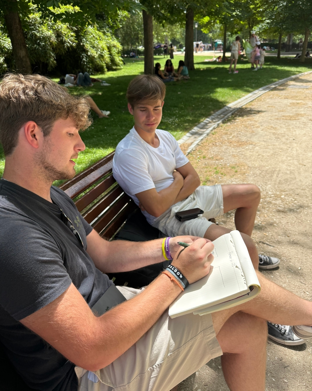 An Immanuel Baptist Church college intern sharing the bridge diagram with someone while on a mission trip in Spain