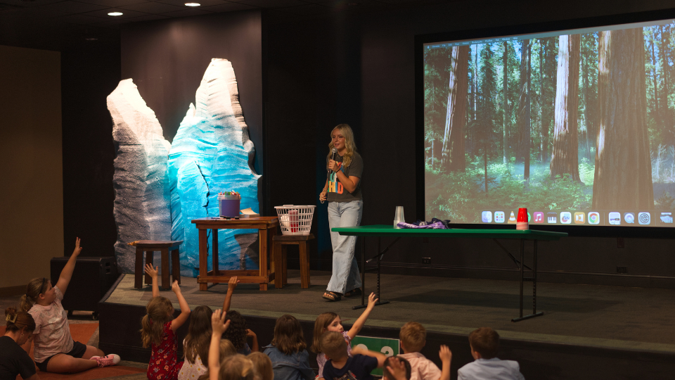 Anna Jo teaching from stage in The Summit