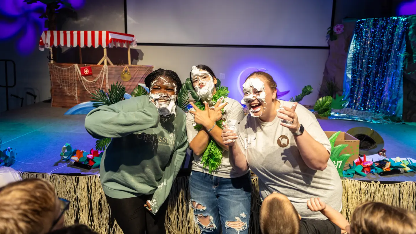 Emily and friends with pie on their faces while serving in IBCKids