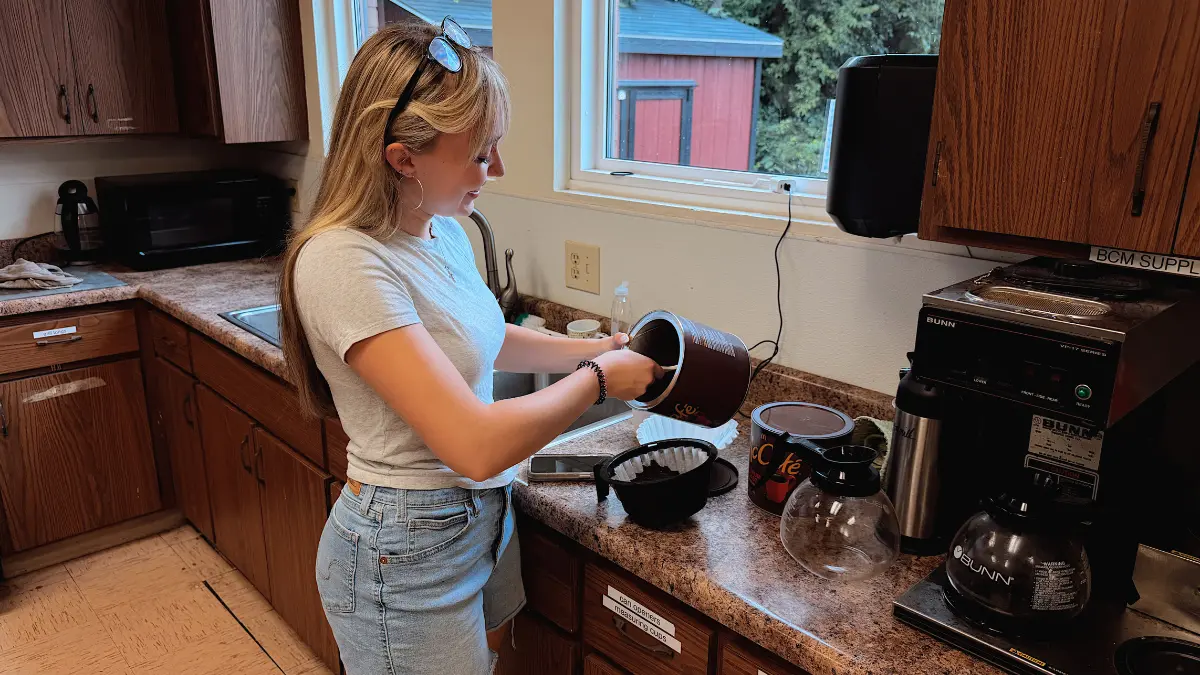 Mackenzie making coffee for a church service at our Richmond Campus