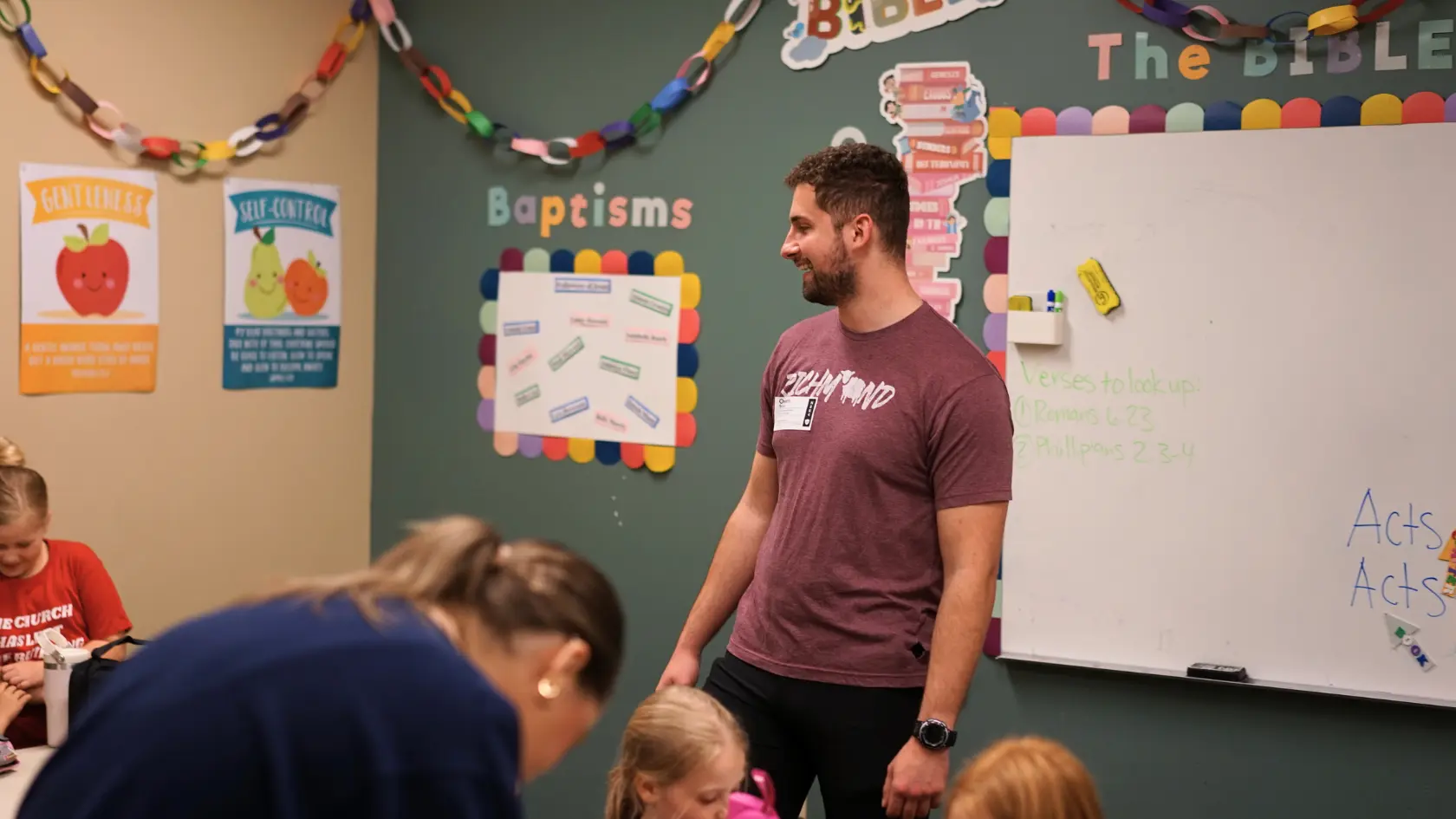 IBCKids volunteer smiling in classroom