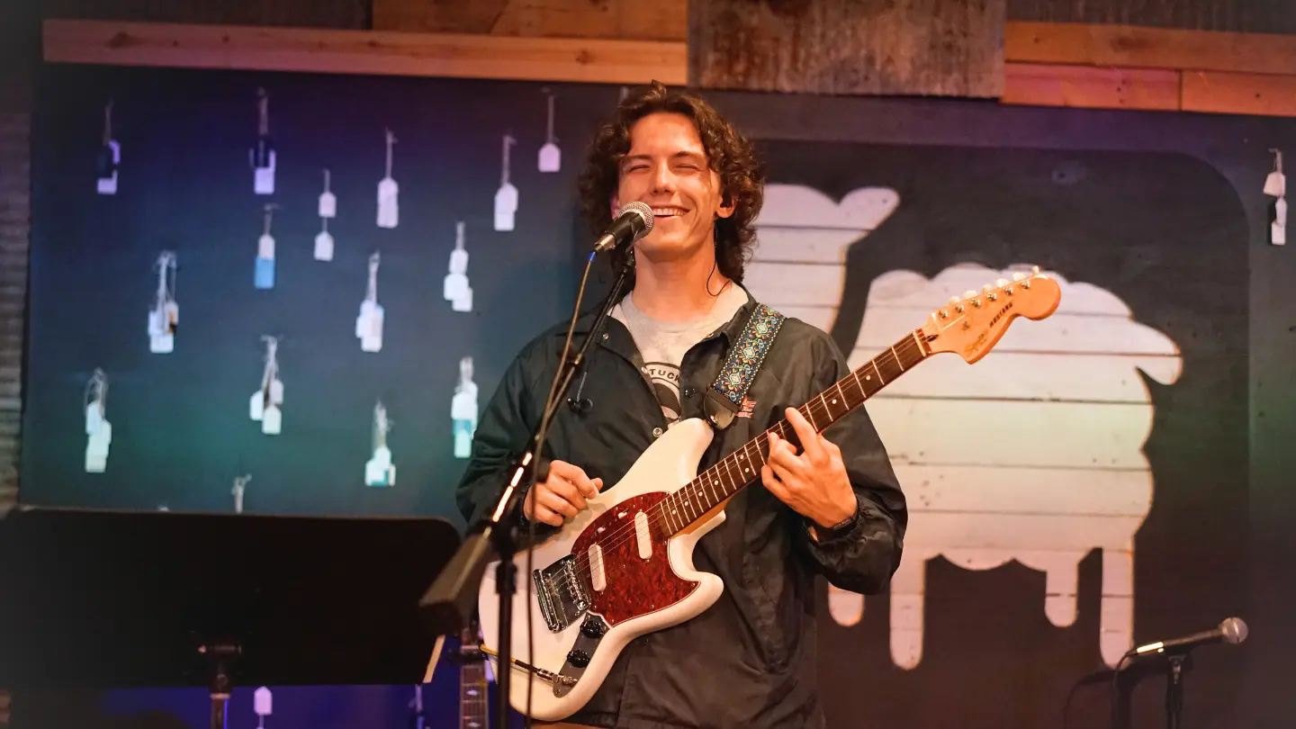 Jonah playing guitar serving on the Immanuel worship team